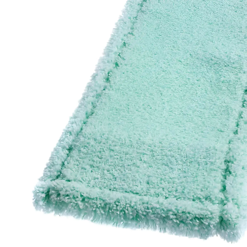 Ein weicher mintgrüner mikrofasermopp von Floorstar mit flauschiger struktur und fransigen kanten