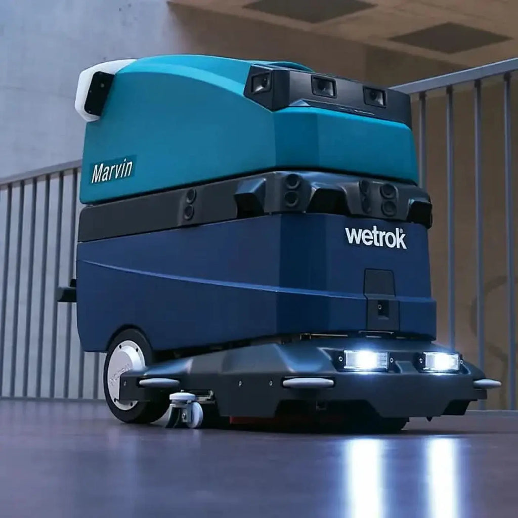 Teal und schwarze robotische bodenreinigungsmaschine wetrok robomatic marvin mit marvin branding oben